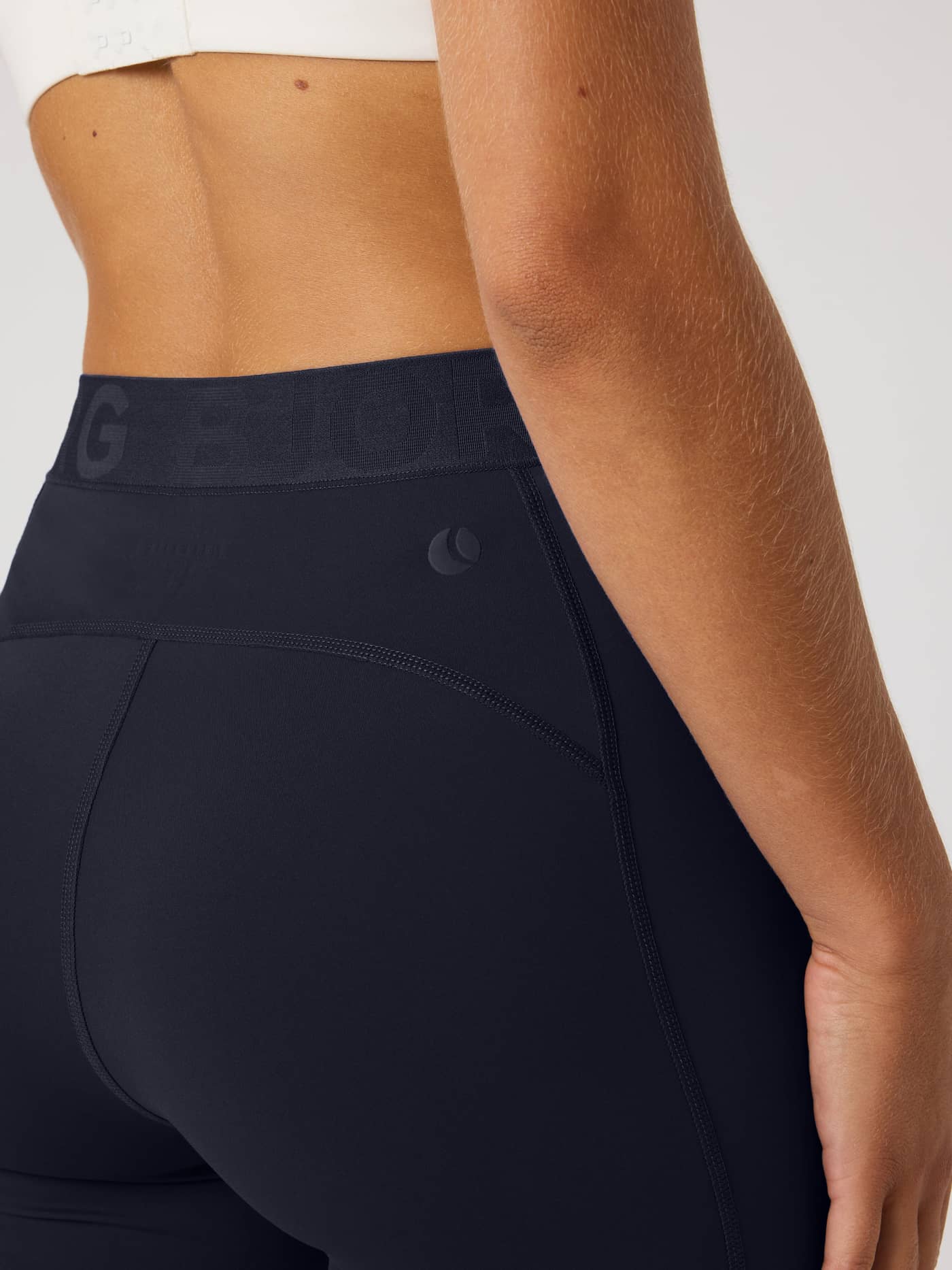Side view of the Borg Short Tights in Night sky (Navy), showing the branded waistband and tonal logo for a training fit. - Image 3