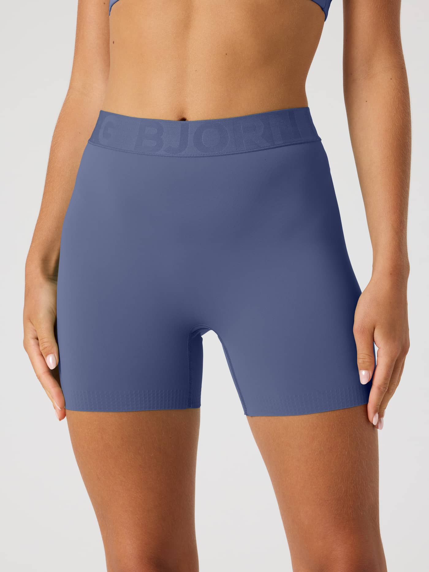 Front view of Borg Short Tights in Nightshadow Blue (Blue) for training and tennis, featuring a branded elastic waistband. - Image 2