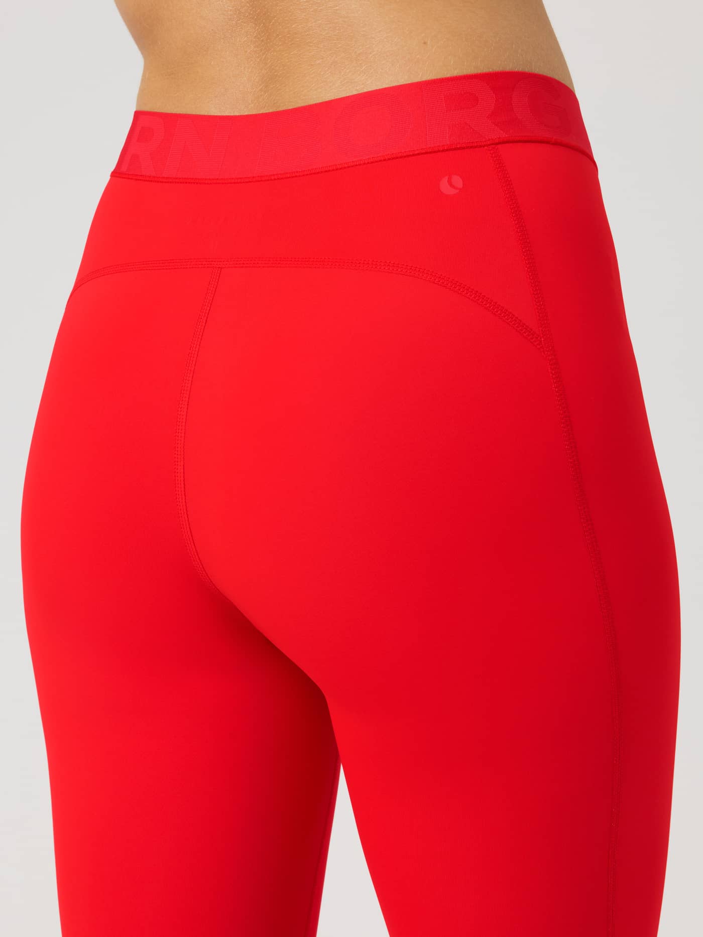 Borg Tights in Flame Scarlet (Red) with a tonal branded waistband, shown in a back view for training and tennis. - Image 4