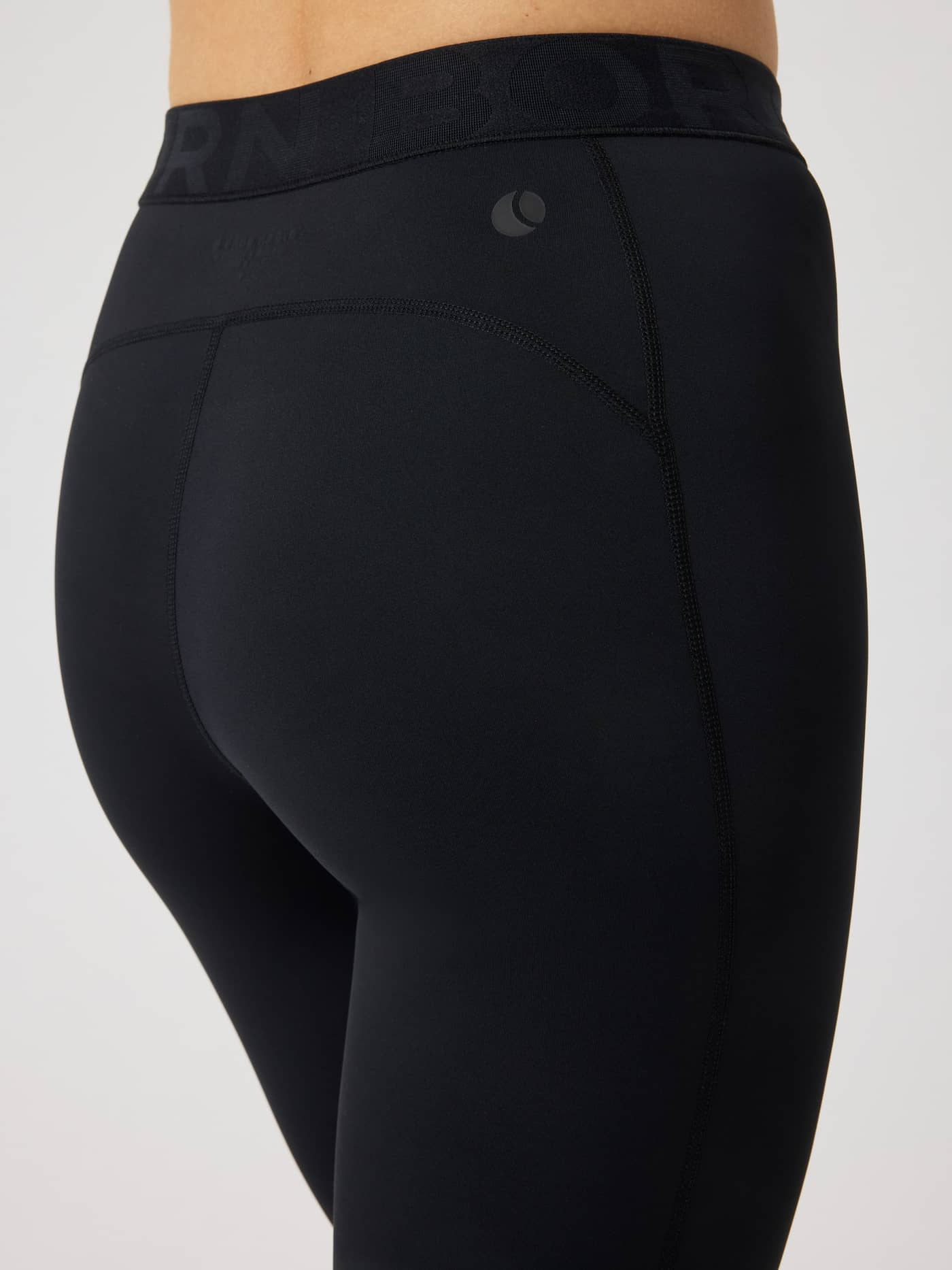 Close-up back view of slim-fit Borg Tights from Björn Borg in Black Beauty (Black) for training with a branded waistband. - Image 4