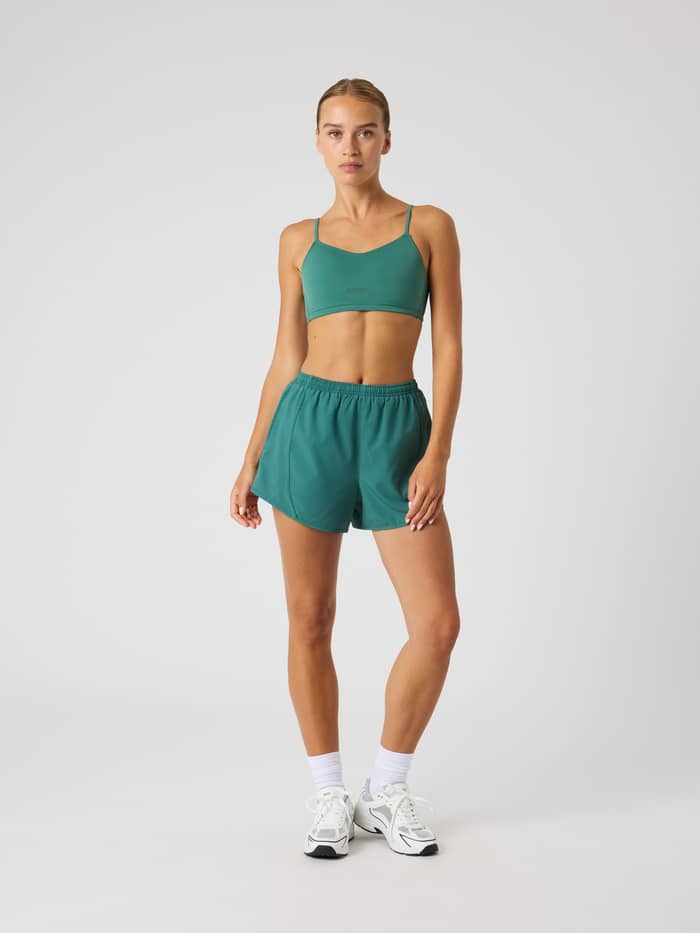 Front view of a model wearing Mallard Green (Green) Borg Sports Shorts, perfect for women's performance training and gym. - Image 3