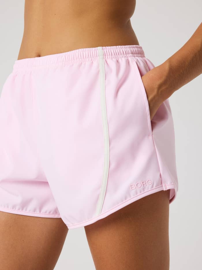 Side view of the Björn Borg Sports Shorts in Pink Lady (Pink) featuring a tonal logo and white piping for training. - Image 4