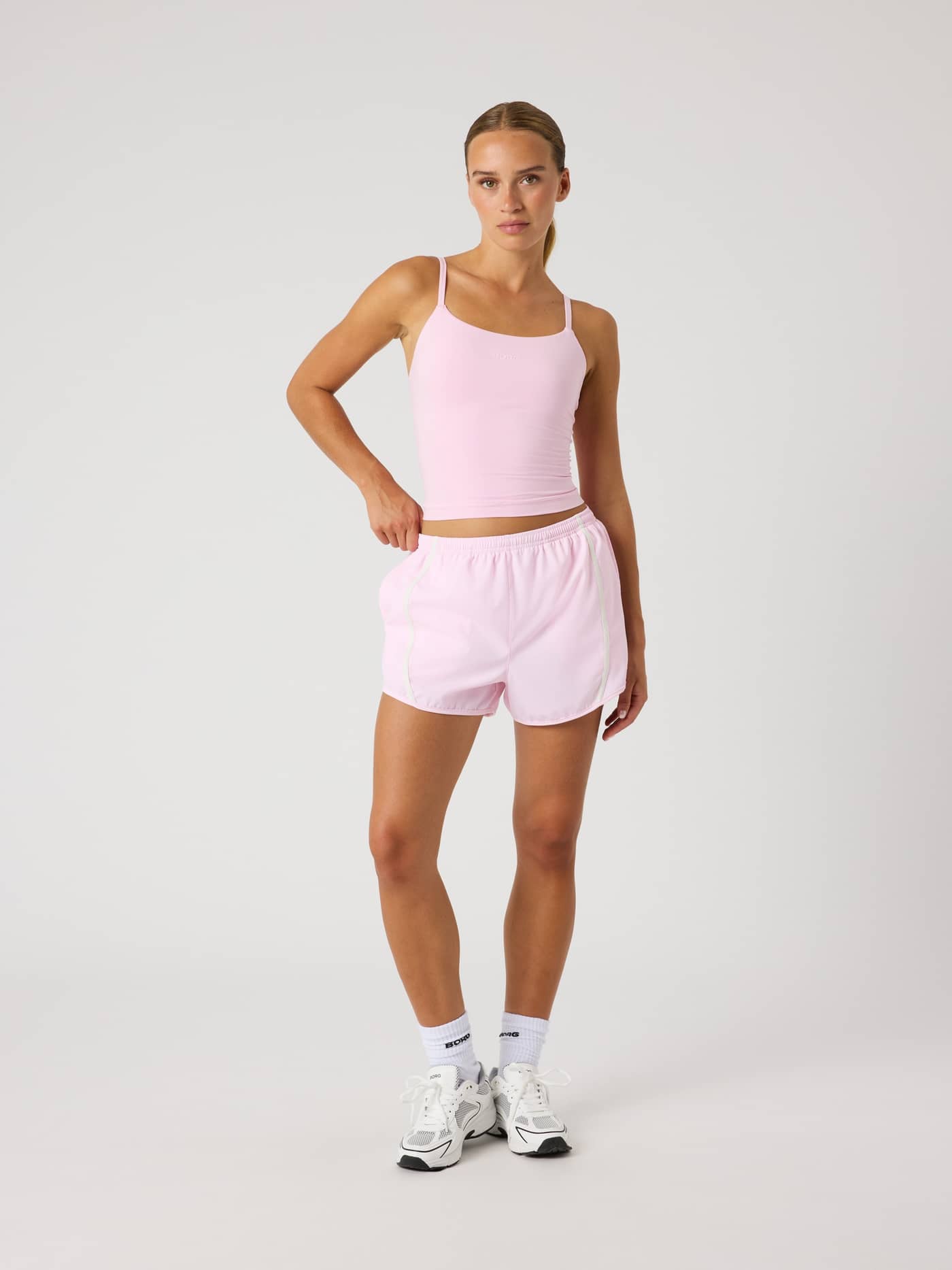 Full-body front view of a model wearing Björn Borg Sports Shorts in Pink Lady (Pink) for training. - Image 3