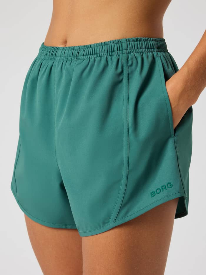 Mallard Green (Green) Borg Sports Shorts for women's training, featuring a tonal logo and elastic waistband. - Image 4