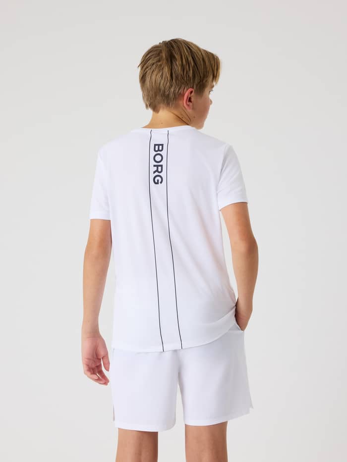 Ace Light T-Shirt i Brilliant White (Hvid) set bagfra på et barn med et navy logo til tennis for kids. - Image 4