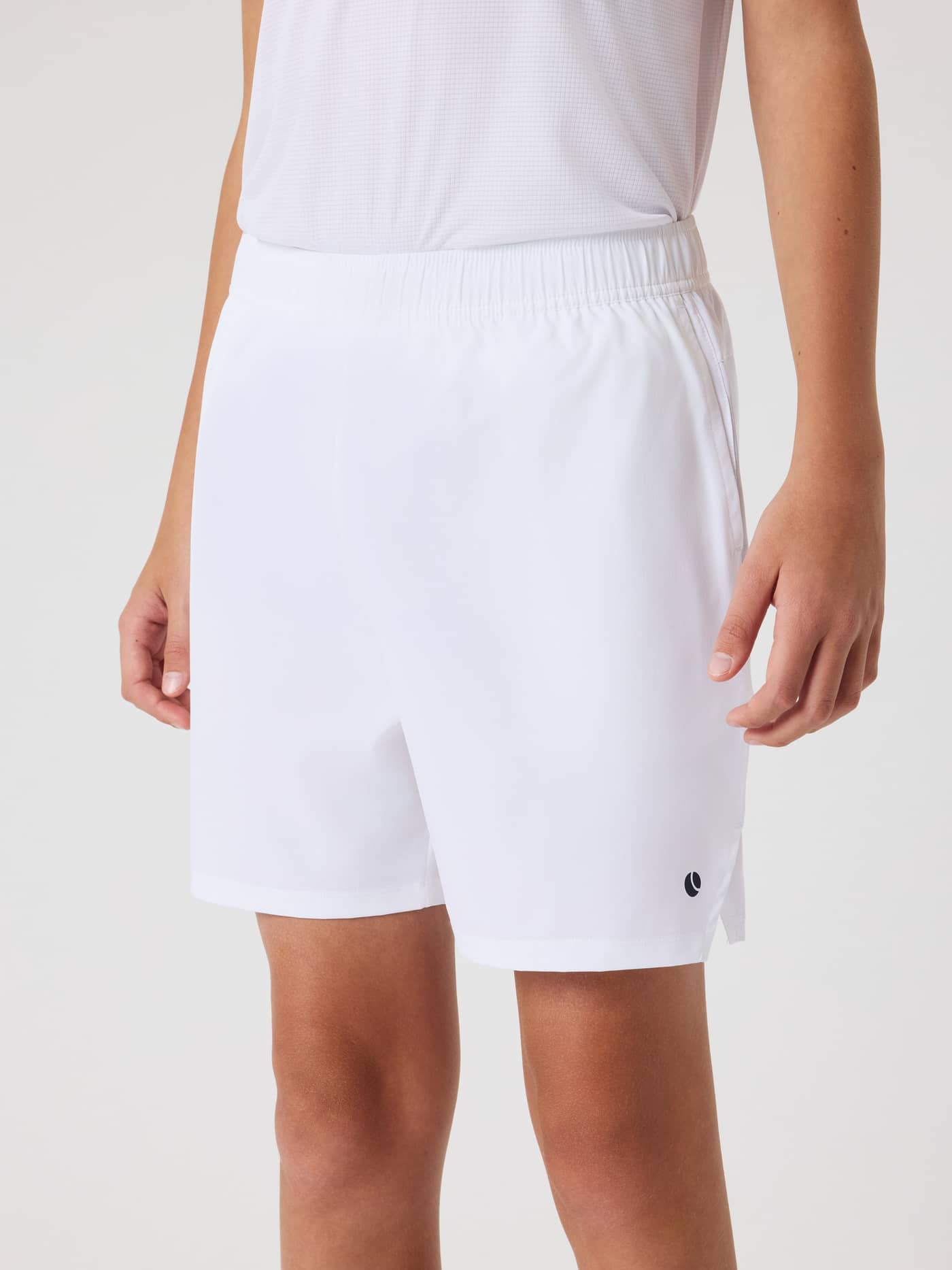 Front view of a kid wearing the Björn Borg Ace Racquet Shorts in Brilliant White (White) for tennis training. - Image 1