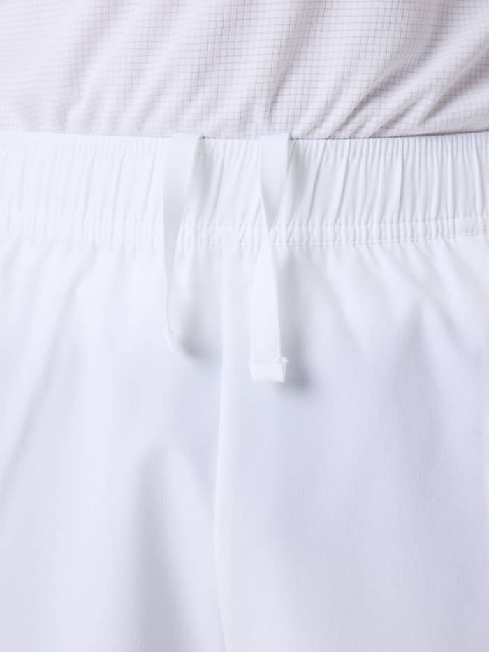 Close-up of the elastic waistband and drawstring on the Ace Racquet Shorts in Brilliant White (White) for kids' tennis. - Image 5