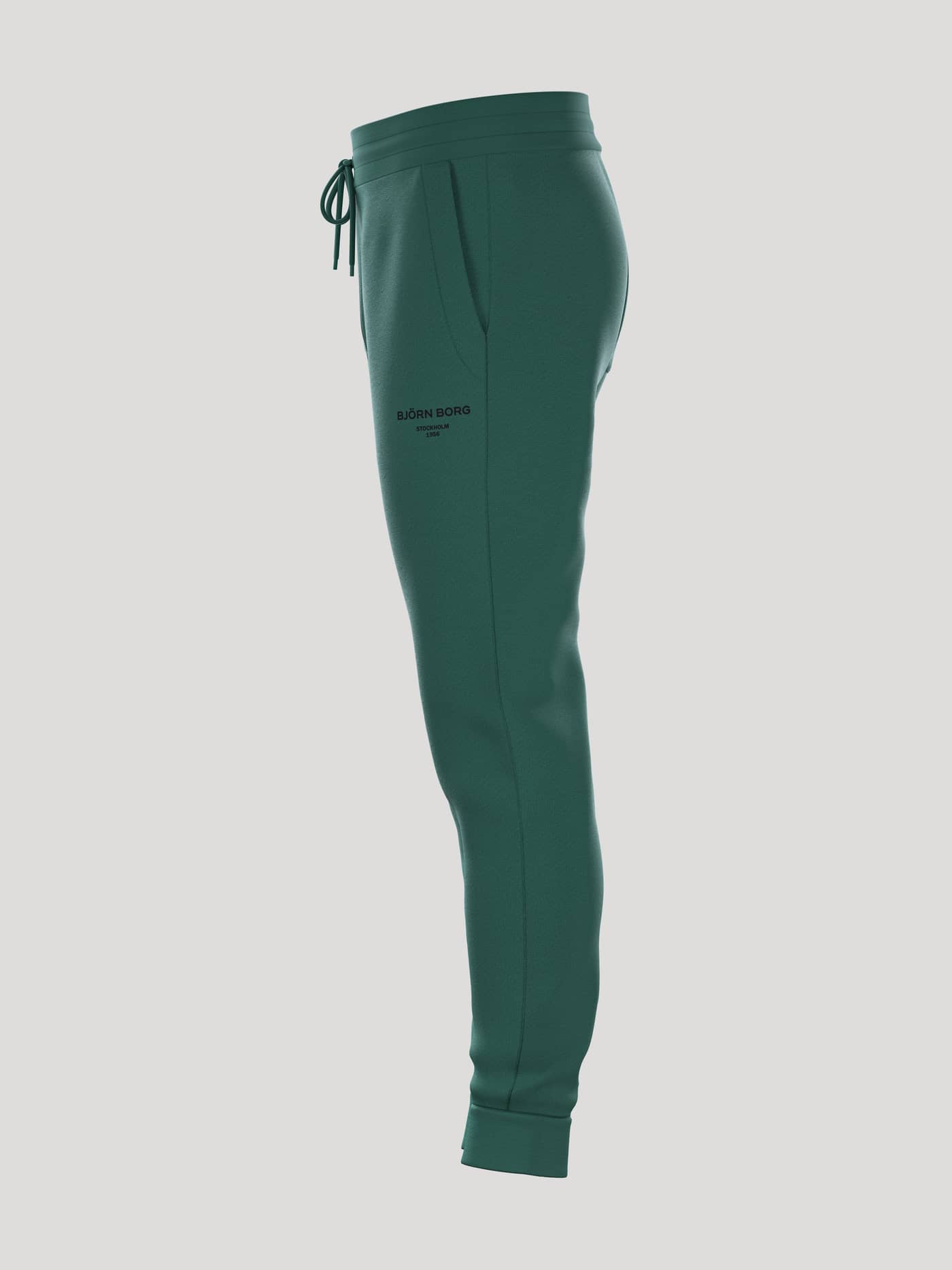 Borg Essential 1 Tapered Sweatpants i Posy Green (Grøn) set fra siden med en stilfuld og afsmalnende pasform til fritid. - Image 4