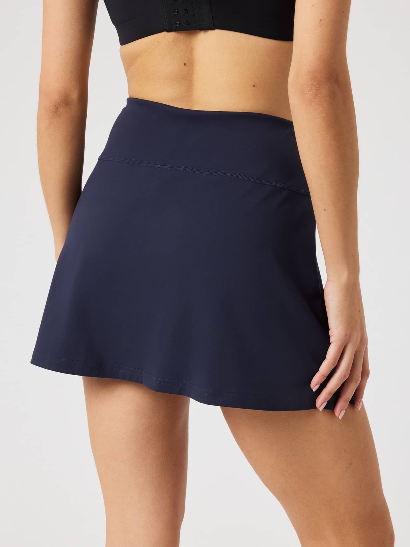 Back view of the Ace Stretch Skirt in Night sky (Navy), featuring a performance fit and stylish design for tennis. - Image 3