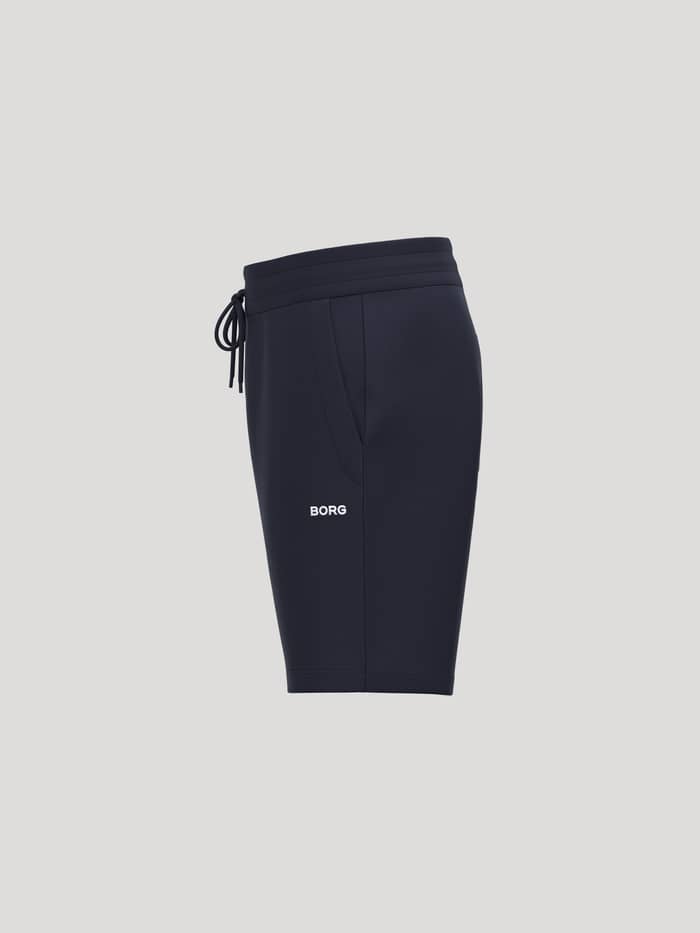 Borg Essential 4 Sweatshorts voor heren in Night Sky (Marineblauw) van french terry met wit logo, zijwaarts aanzicht. - Image 3