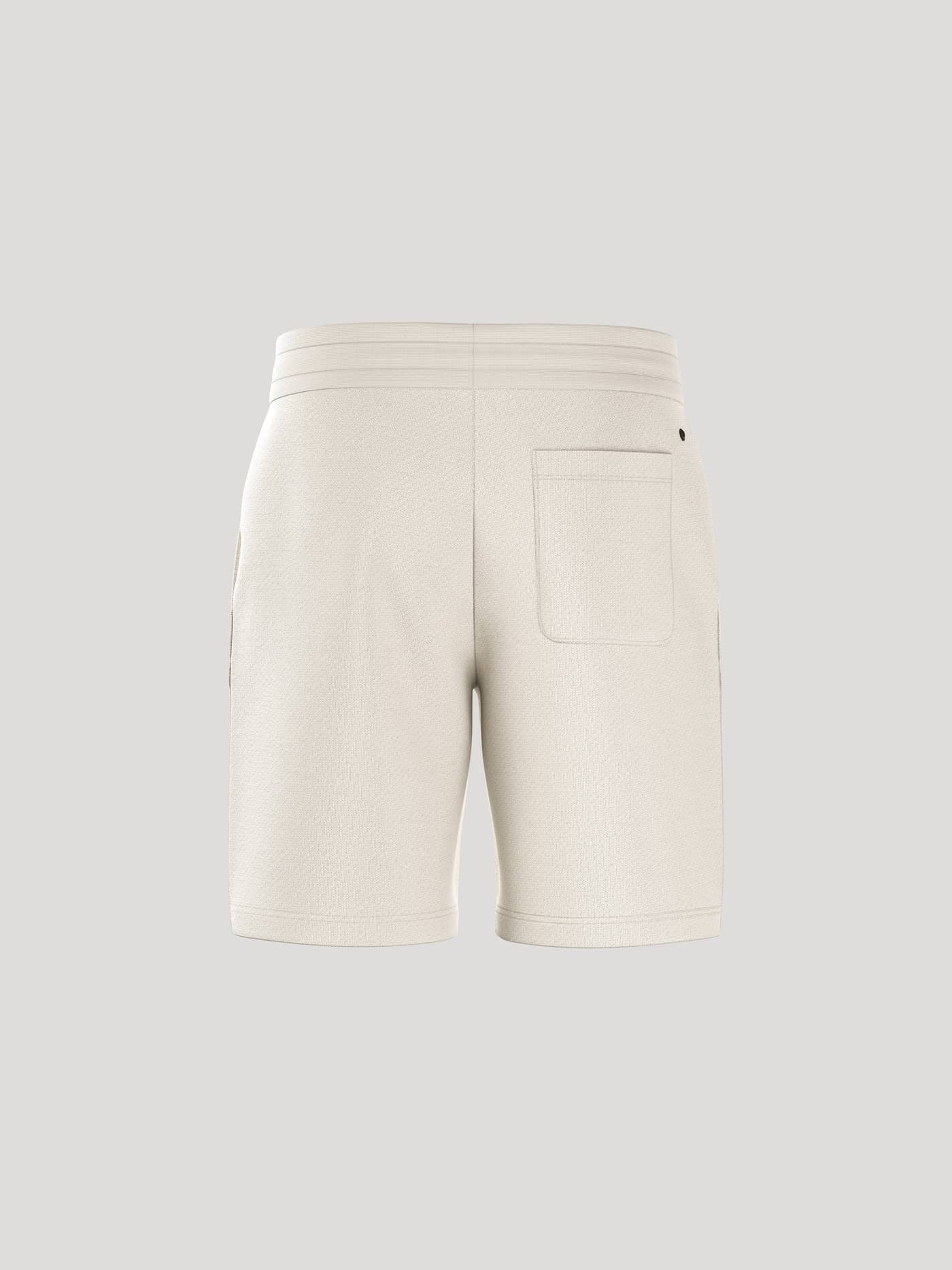Back view of the regular-fit Borg Essential 4 Sweatshorts in Tofu (White) featuring a functional back pocket. - Image 3