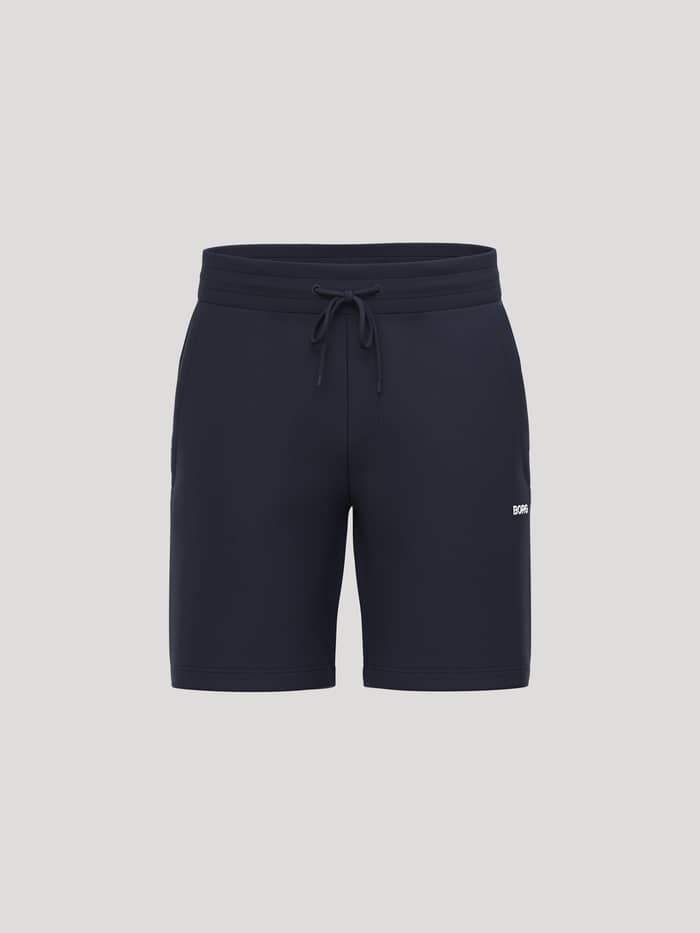Borg Essential 4 Sweatshorts in Night sky (Marineblauw) van french terry met wit logo in vooraanzicht.