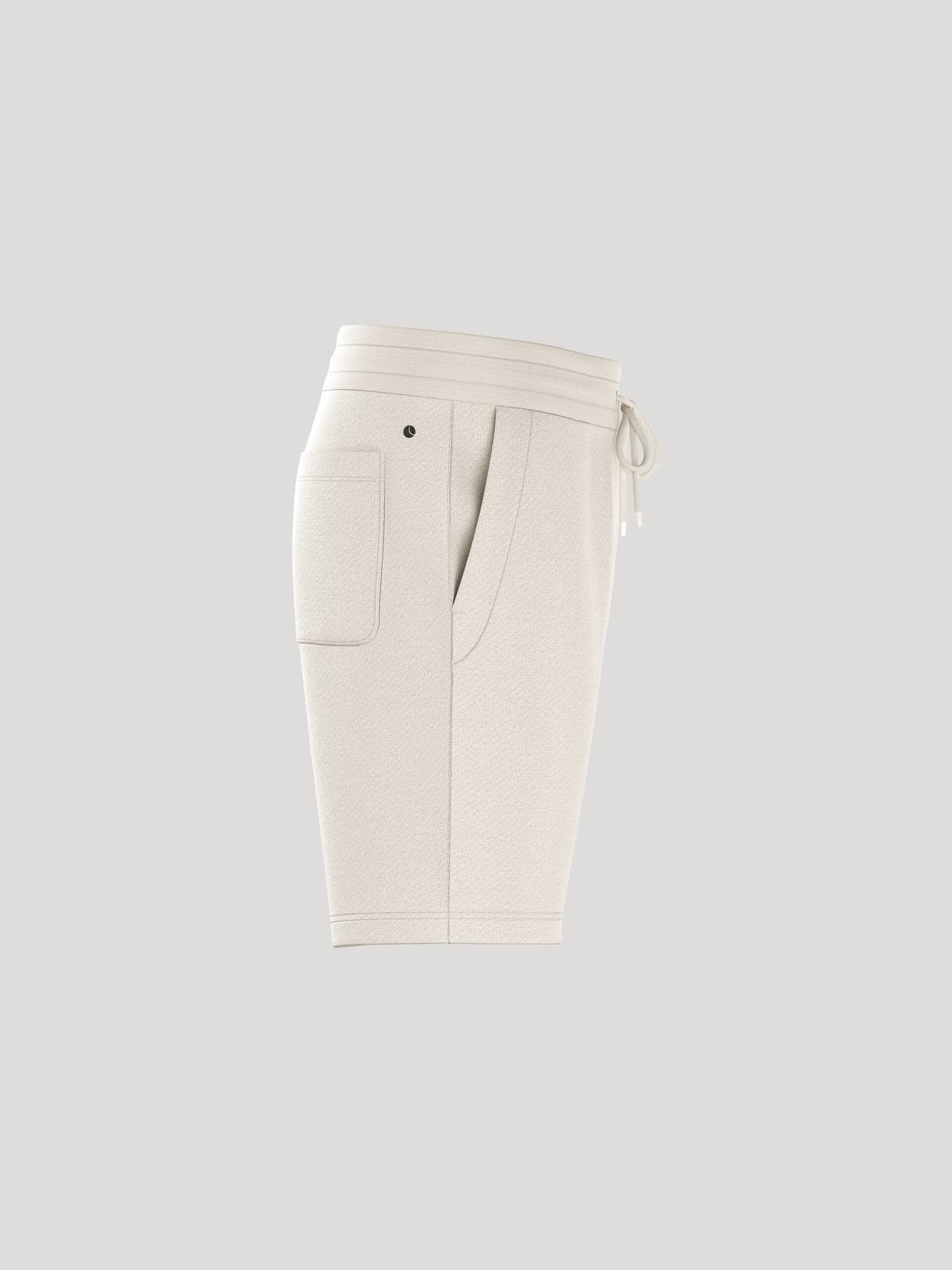Side view of the Borg Essential 4 Sweatshorts in Tofu (White), featuring a ribbed waistband, side pockets and a black logo. - Image 2