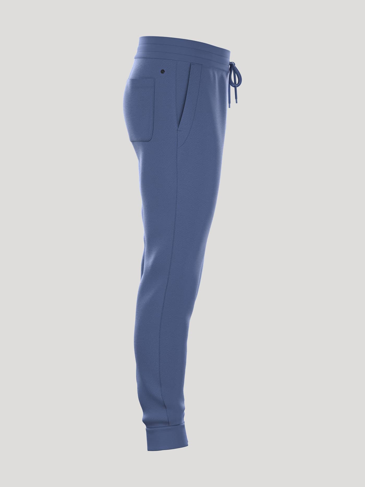Side view of the Borg Essential 4 Tapered Sweatpants in Coastal Fjord (Blue), featuring a tapered fit and subtle black logo. - Image 2