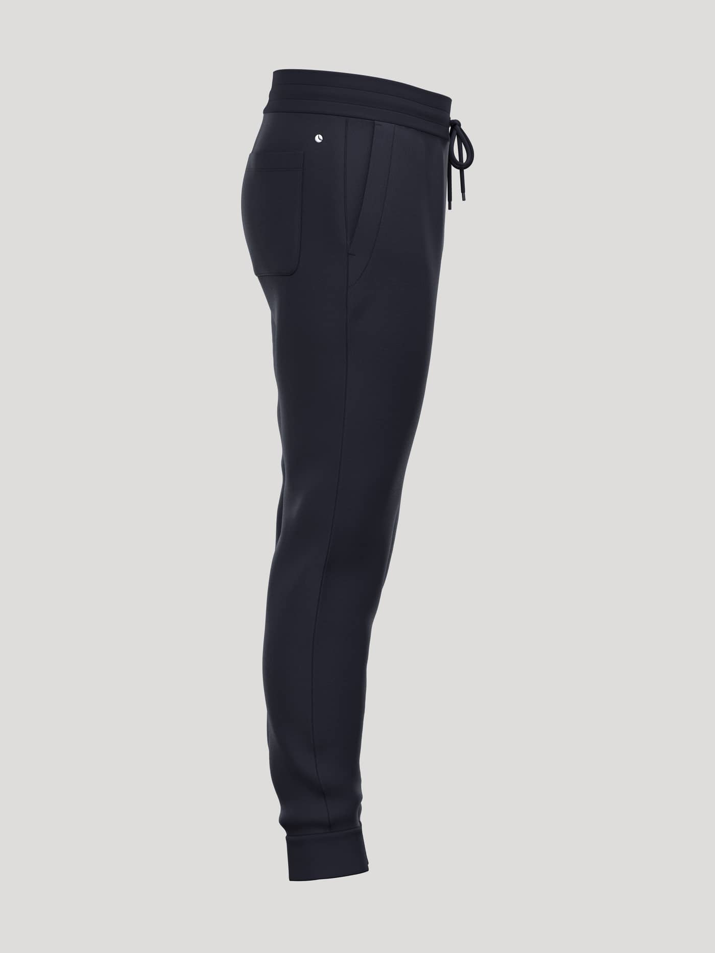 Side view of the Borg Essential 4 Tapered Sweatpants in Night sky (Navy) with a functional fit and tapered leg. - Image 4