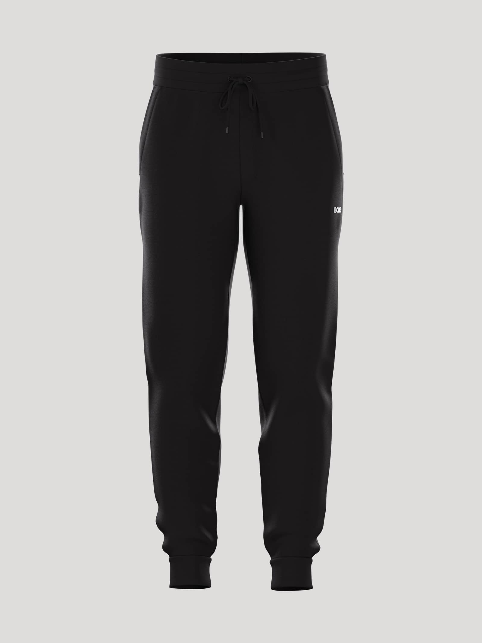 Borg Essential 4 Tapered Sweatpants i Black Beauty (Svart) sedda framifrån med vit logotyp och avsmalnande ben. - Image 1