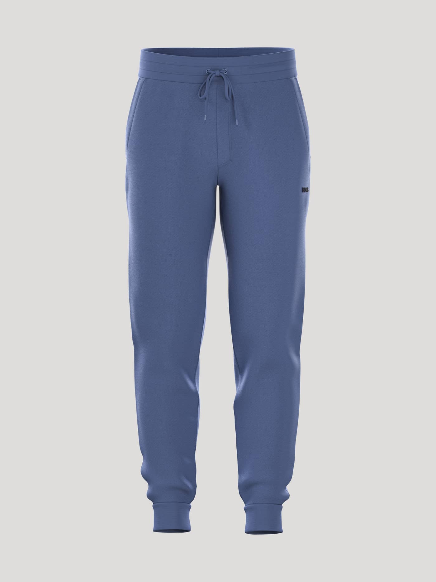 Borg Essential 4 Tapered Sweatpants sedda framifrån i Coastal Fjord (Blå) med svart logotypbrodyr. - Image 1