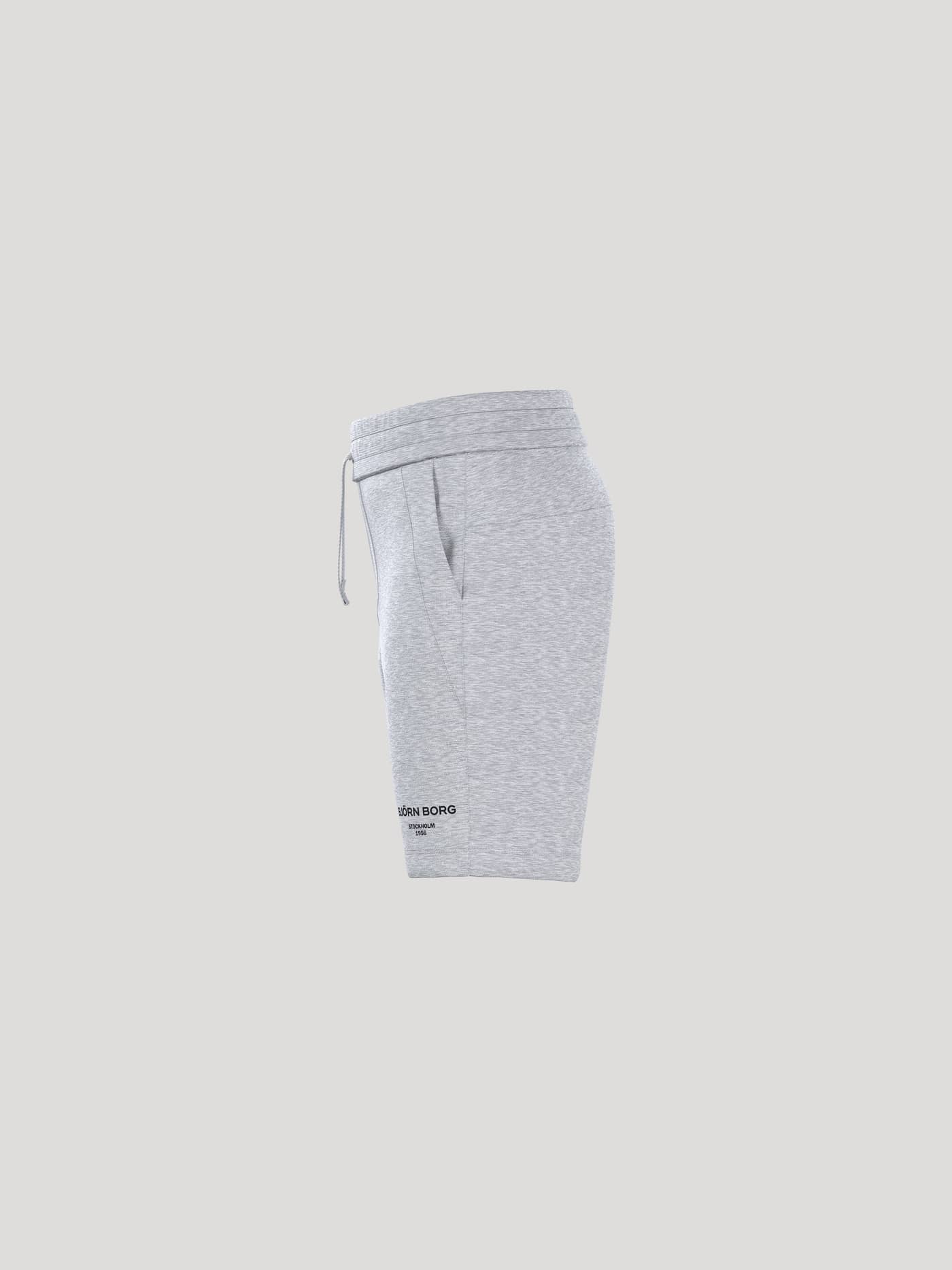 Side view of kids' Borg Essential 1 Sweatshorts in Light Grey Melange (Grey) with a regular fit and black logo. - Image 4