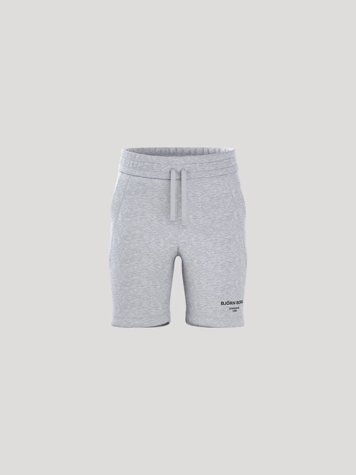 Borg Essential 1 Sweatshorts för kids i Light Grey Melange (Grå) med regular fit sedda framifrån och svart logotyp.