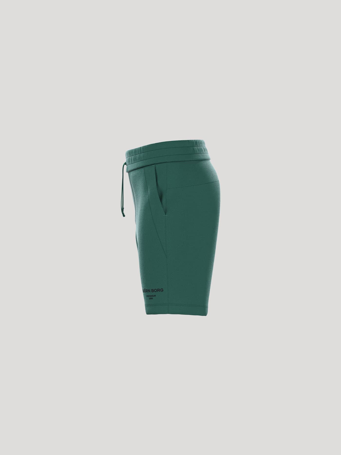Zijaanzicht van de Borg Essential 1 Sweatshorts voor kids in Posy Green (Groen) met een verstelbaar trekkoord en logo. - Image 4
