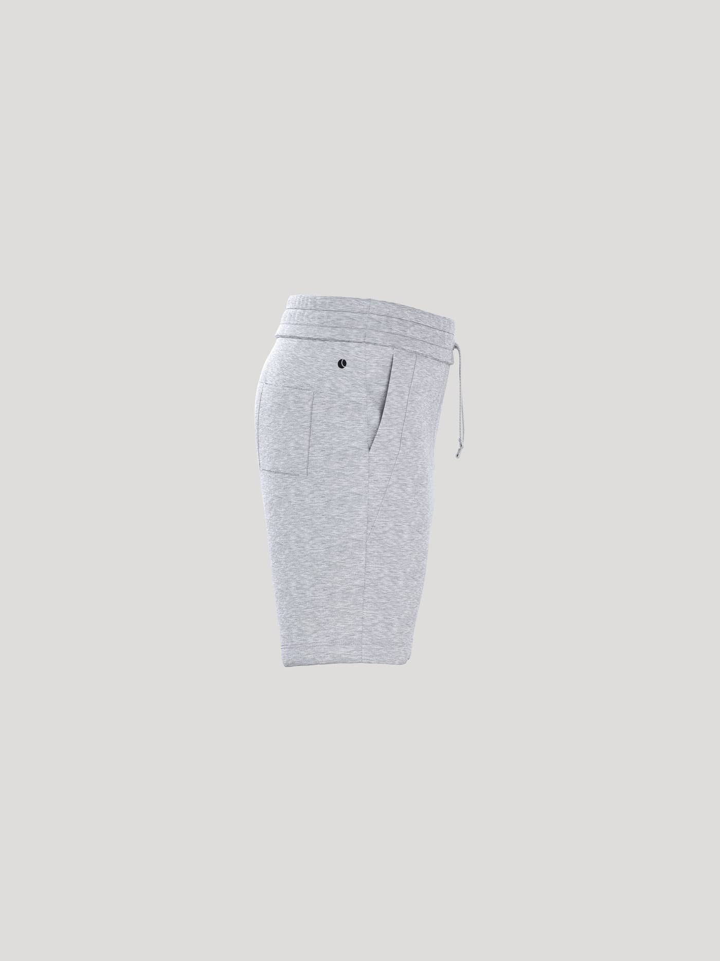 Side view of kids' Borg Essential 1 Sweatshorts in Light Grey Melange (Grey) in soft fleece with a black logo. - Image 2
