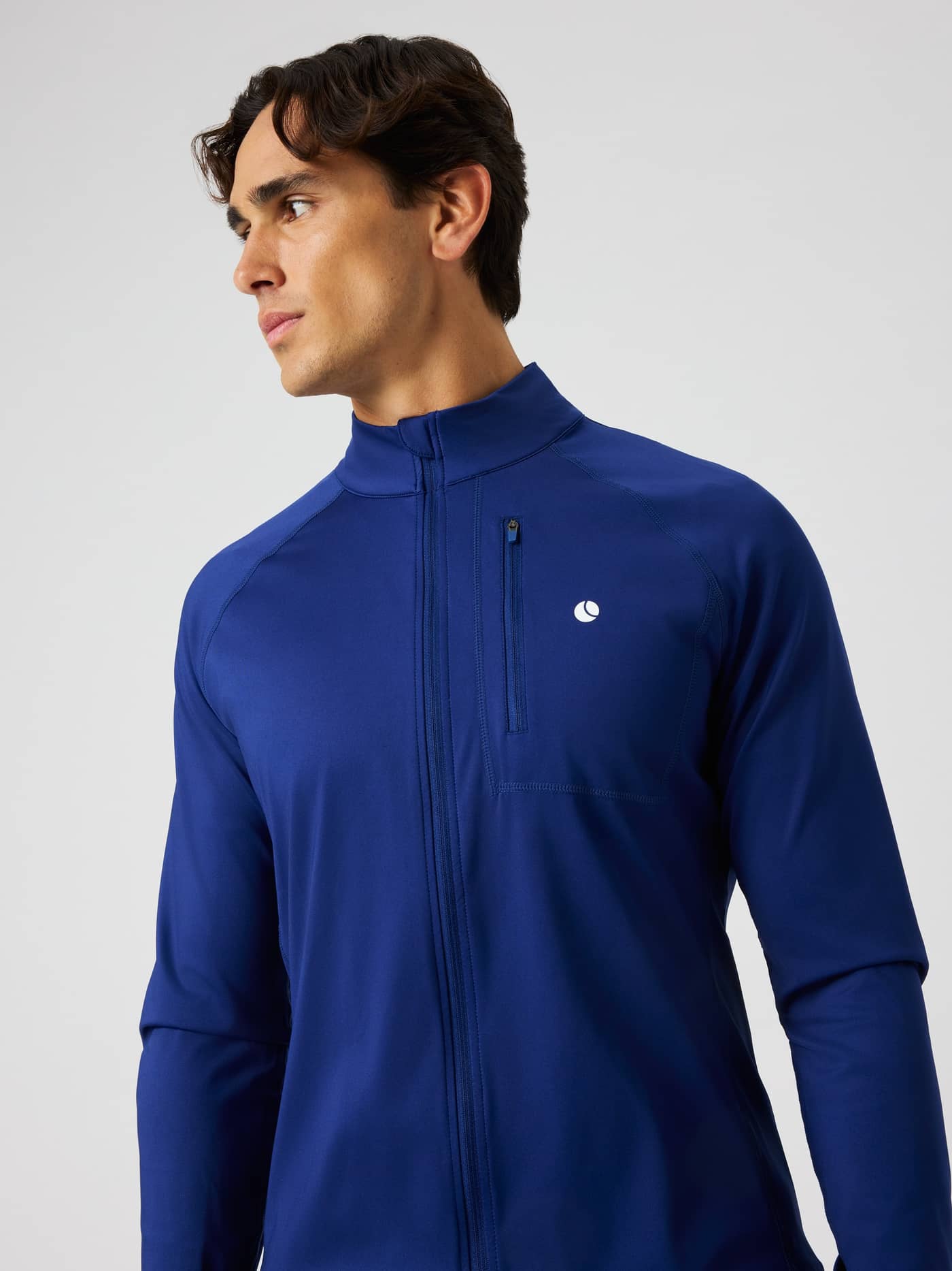 Side profile of a man in the Blue Depths (Blue) Björn Borg Ace Training Jacket, a functional performance layer for tennis. - Image 4