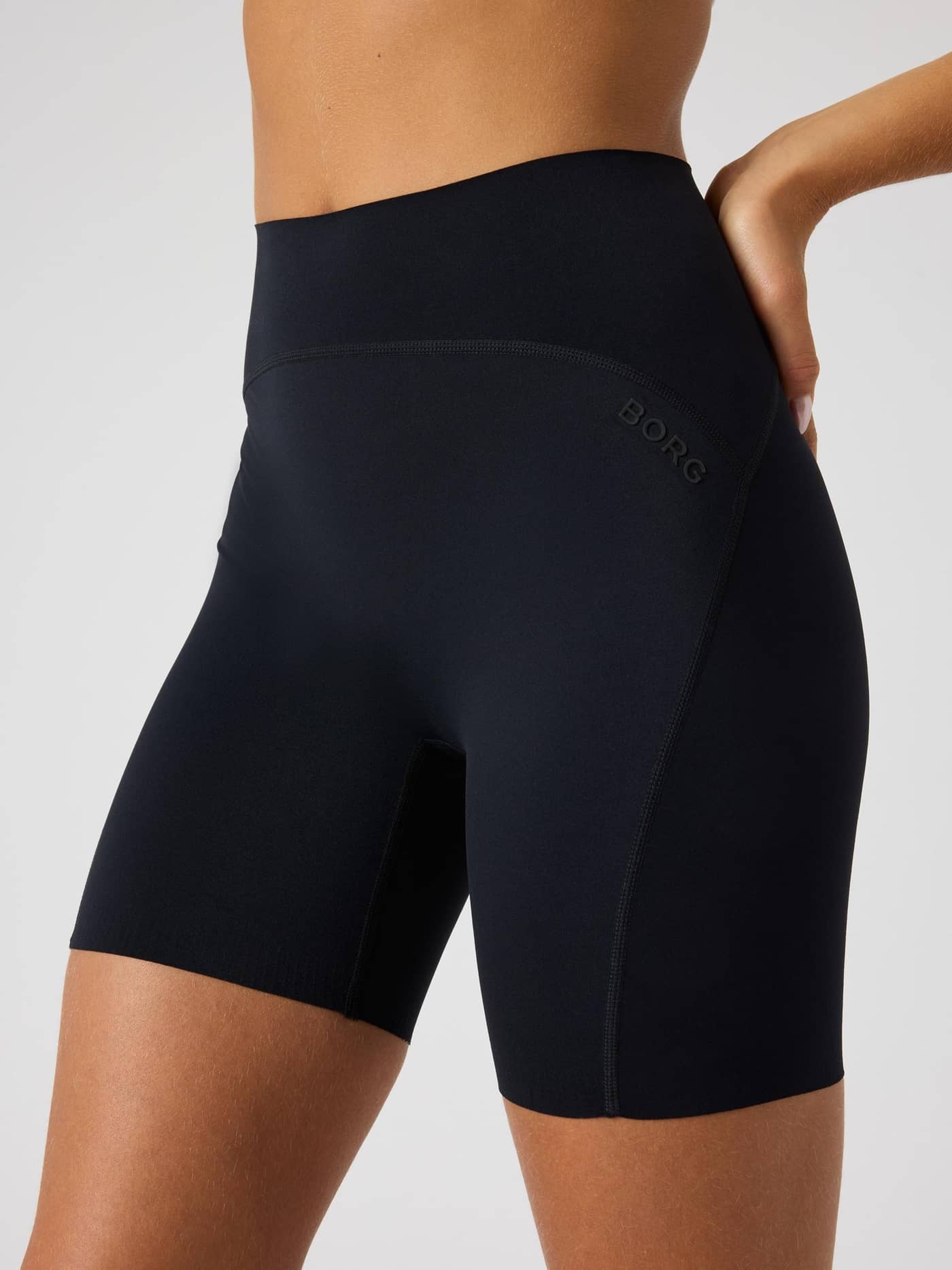 Close-up side view of the Borg Sleek Shorts in Black Beauty (Black) with a black logo, for training style and fit. - Image 4