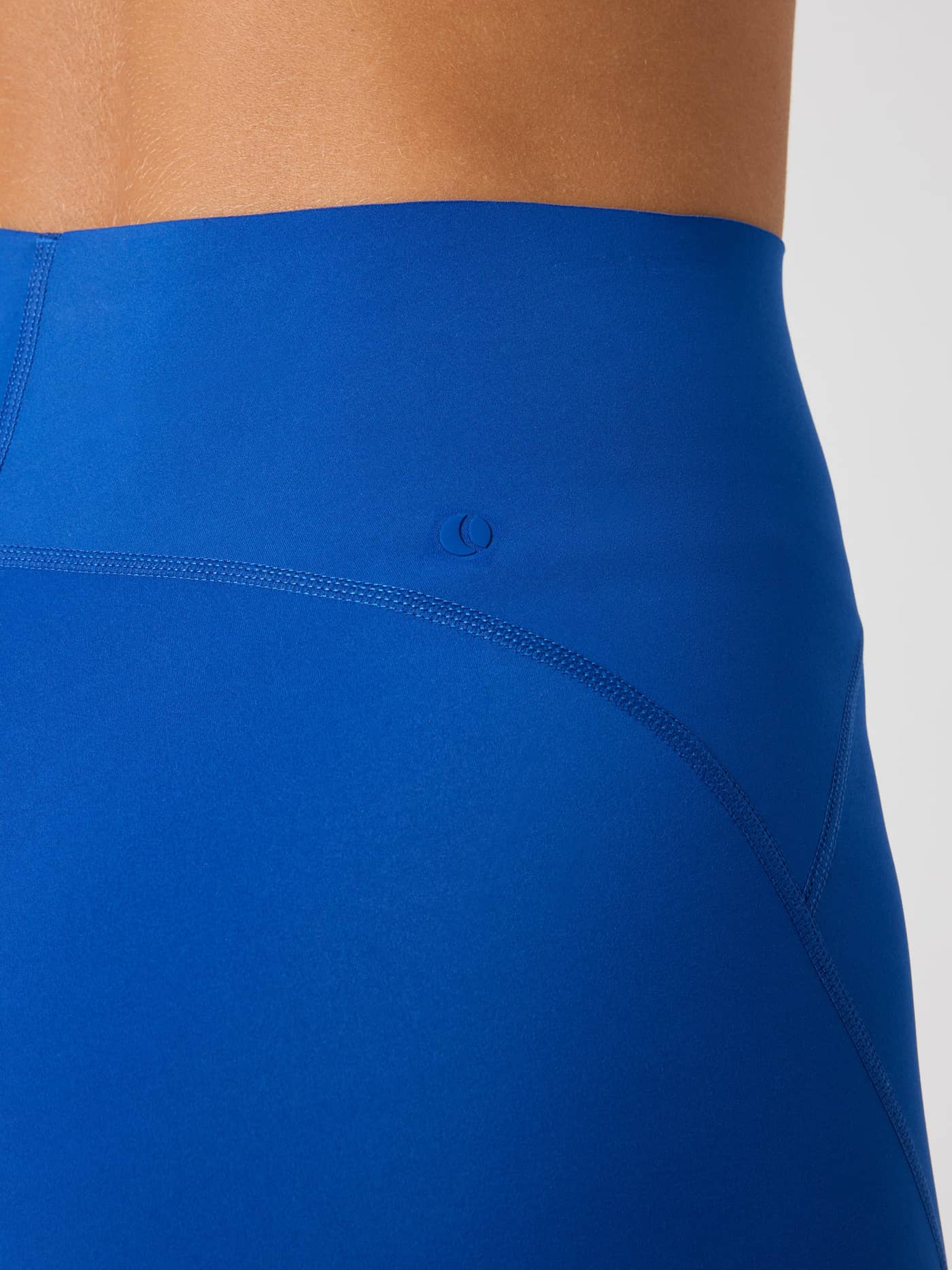Close-up of the high waist Borg Sleek Shorts in Monaco Blue (Blue), featuring a tonal logo and fit for performance training. - Image 5