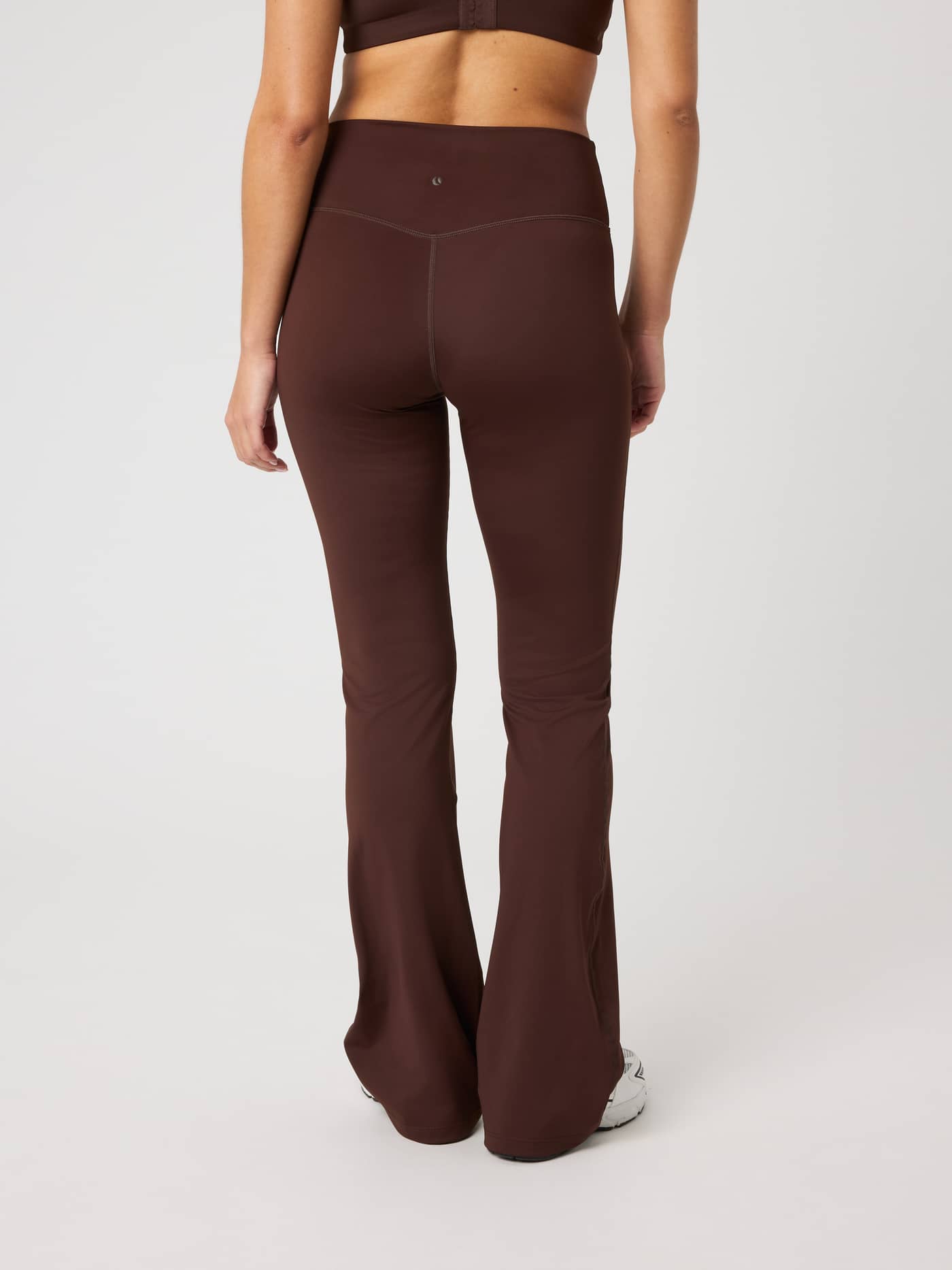 Borg Flare Tights Regular in Coffee Bean (Brown) with a flared leg and tonal back logo for training, back view. - Image 2