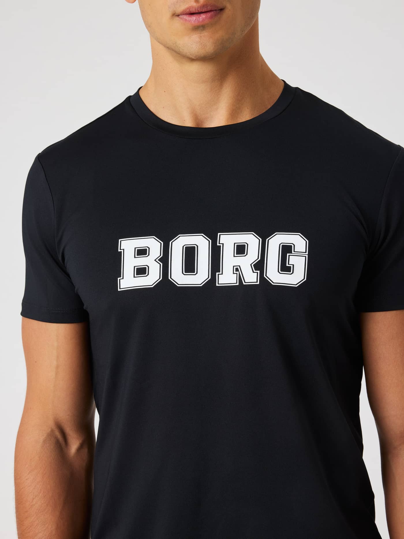 Front close-up of the Borg Graphic T-Shirt in Black Beauty (Black) with a white chest logo for training and tennis. - Image 4
