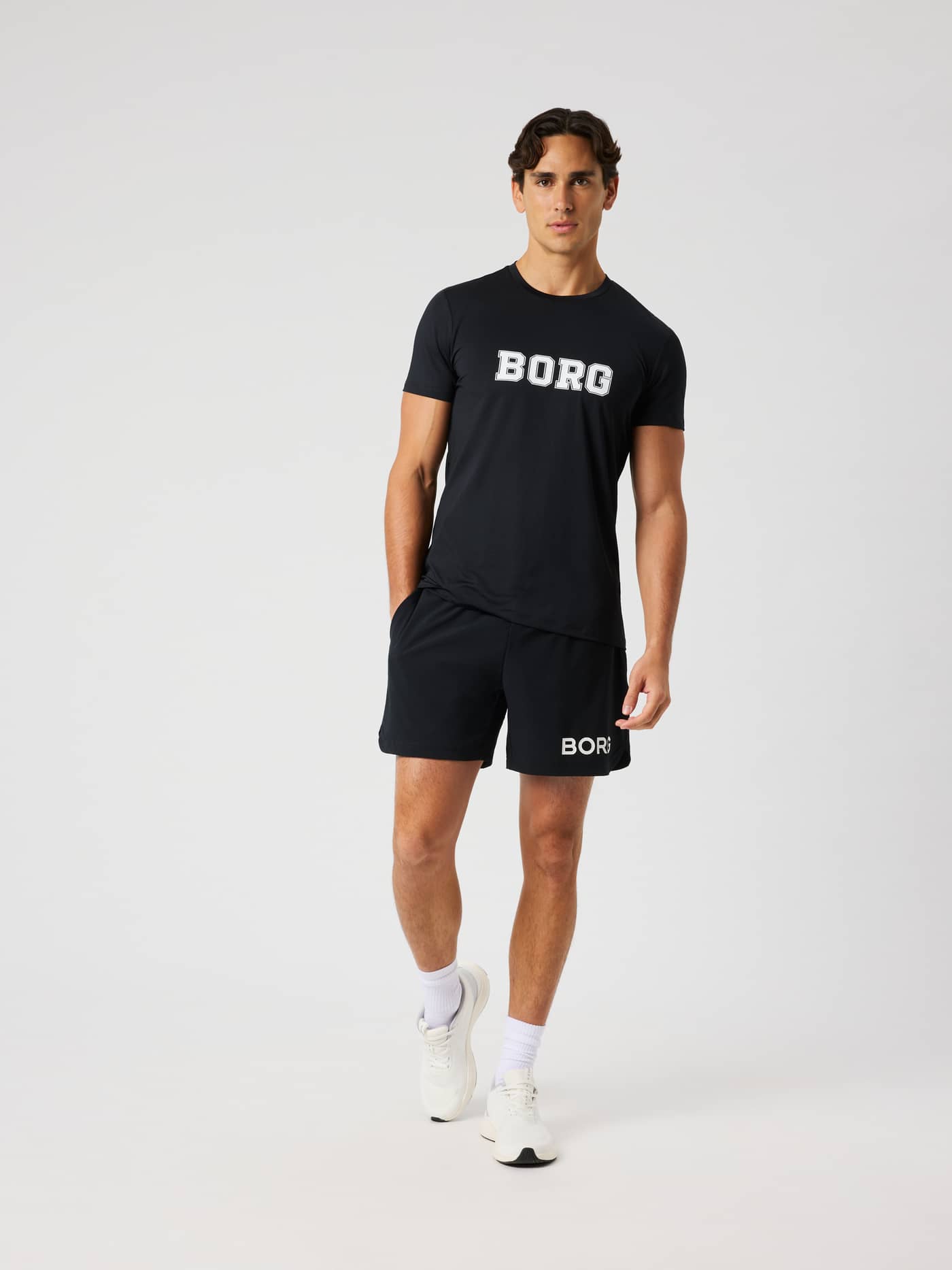 Full-body front view of a man wearing the functional Borg Graphic T-Shirt in Black Beauty (Black) for training and tennis. - Image 3