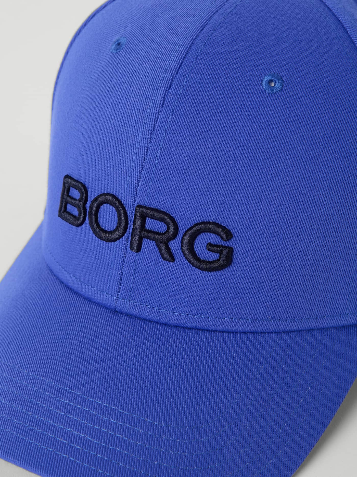 Close-up of the Björn Borg Borg Baseball Cap in Amparo Blue (Blue), featuring the embossed logo on the front. - Image 3