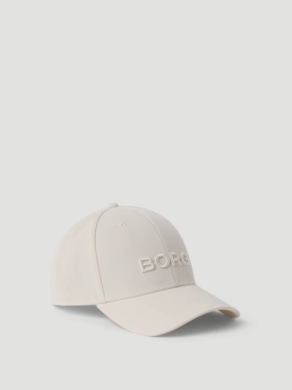 Vue de trois-quarts face de l'élégante Borg Baseball Cap en Tofu (Blanc) en polyester recyclé.