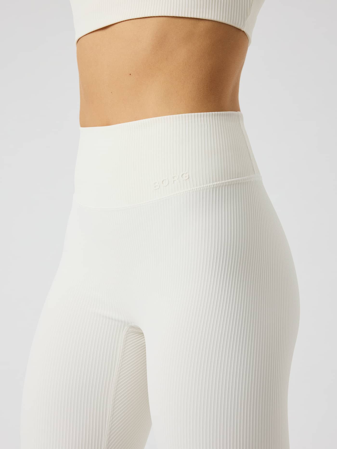 Studio Ribbed Tights in Tofu (White) featuring a high-waisted fit, ribbed texture, and tonal BORG logo for training. - Image 5