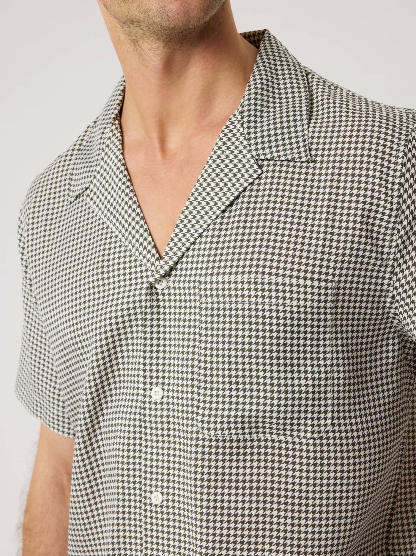 Borg Lyocell Resort Shirt in Houndstooth 3 (Black and White) in a close-up showing the soft fabric and camp collar. - Image 5