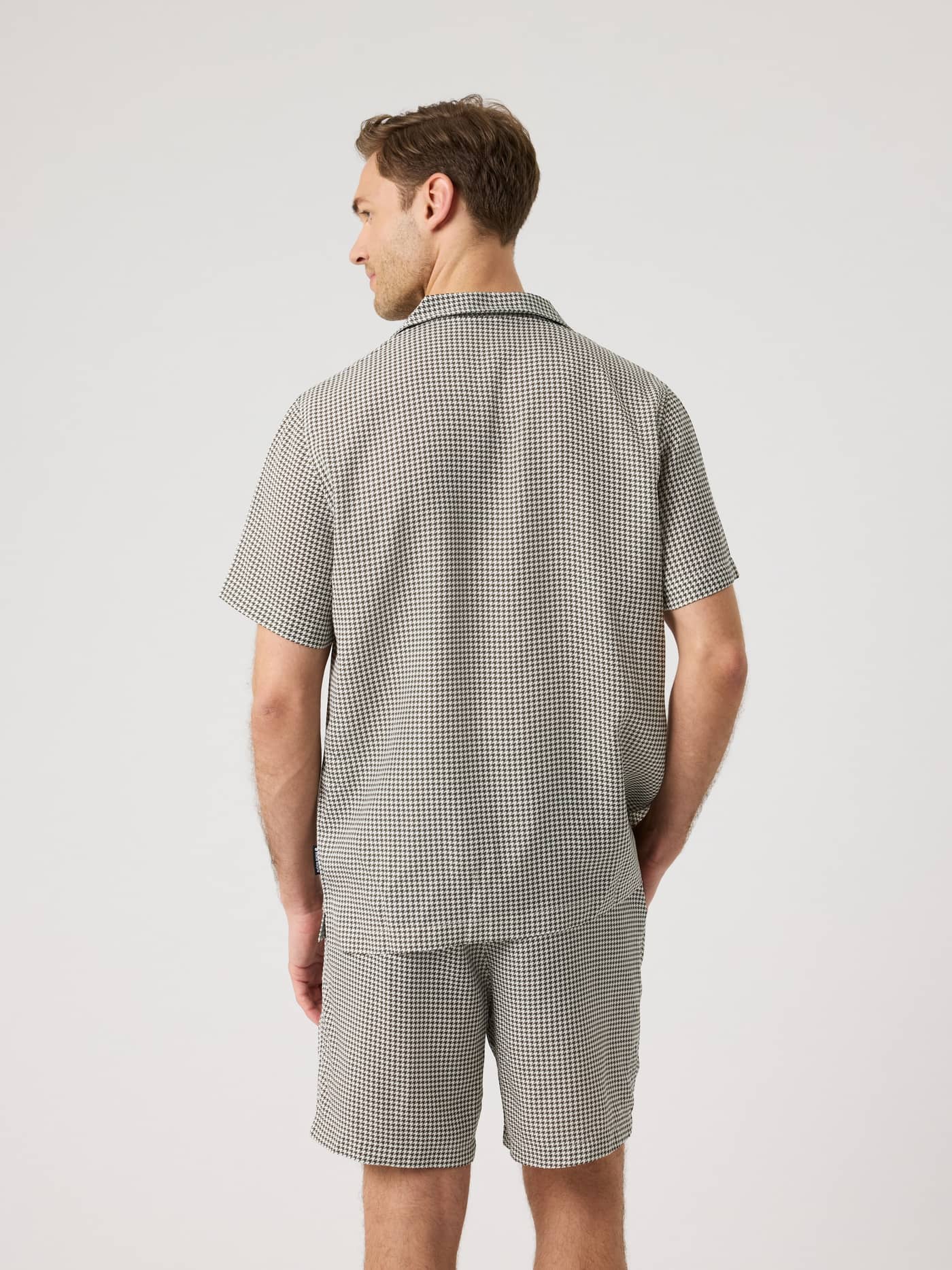 Back view of a man wearing the Björn Borg Lyocell Resort Shirt in Houndstooth 3 (Black and White). - Image 3