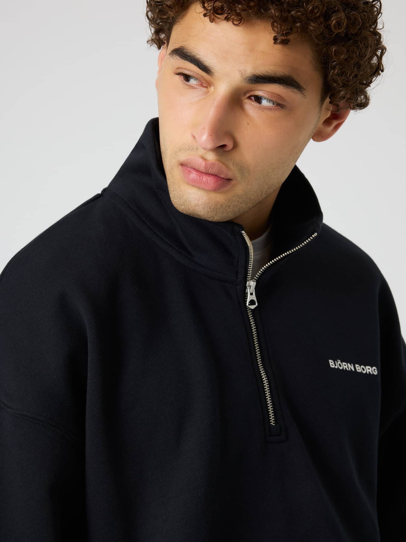 Borg Oversized Half-Zip in Black Beauty (Black) featuring a white chest logo and half-zip for a premium training look. - Image 5