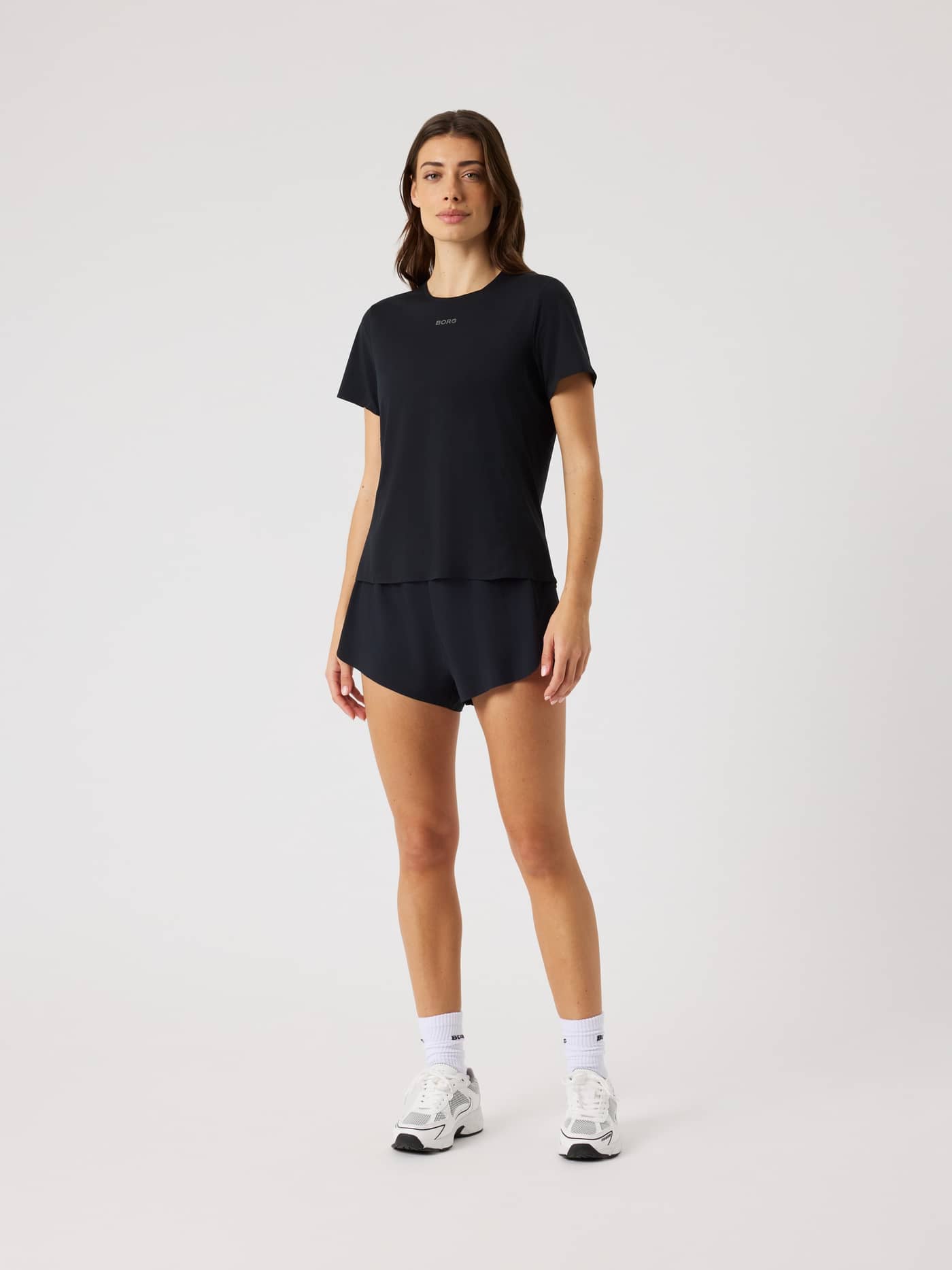 Front view of a woman wearing Black Beauty (Black) Borg Performance 2 In 1 Shorts, perfect for running and training. - Image 3