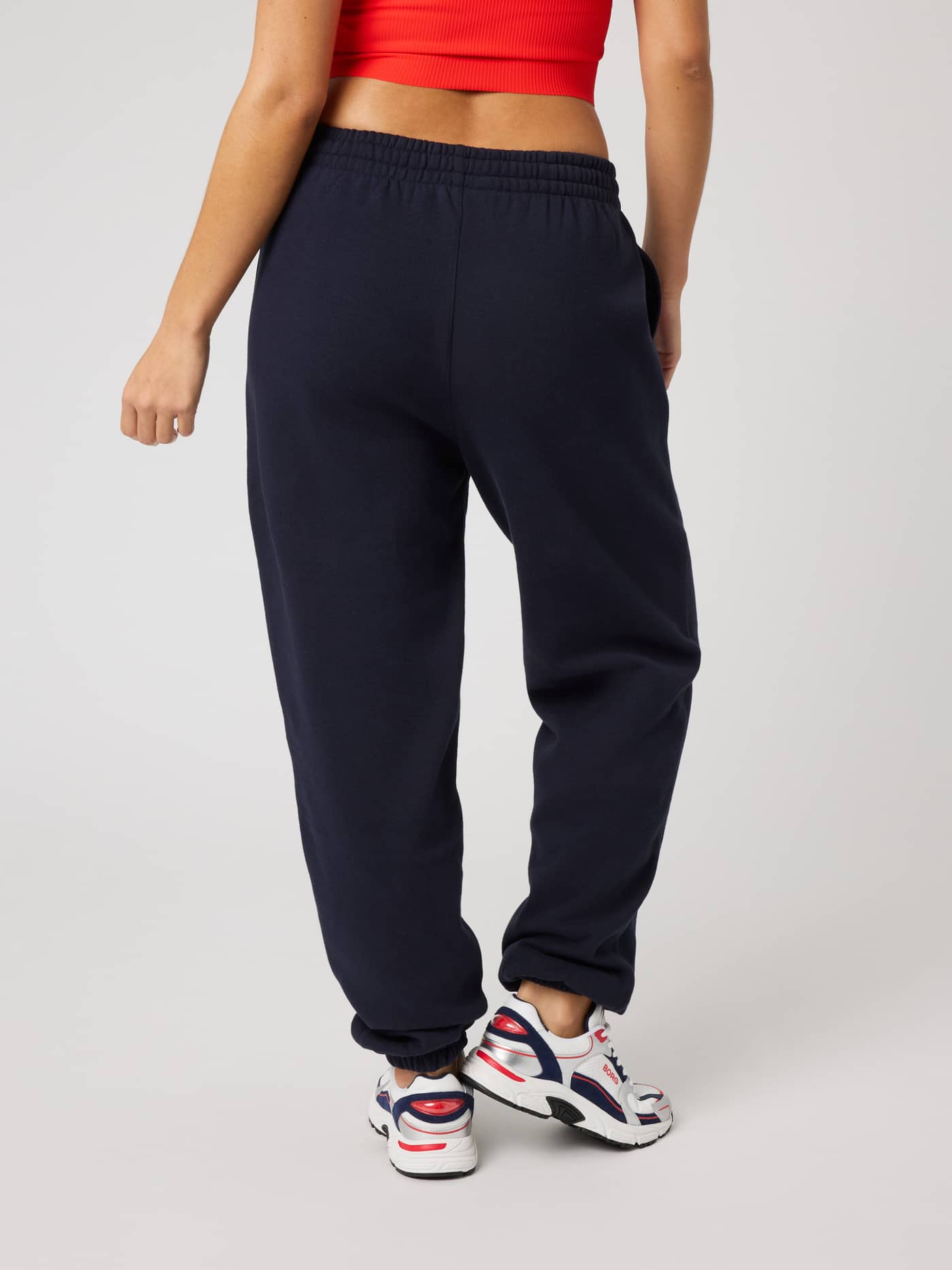 Back view of a woman wearing the Borg Sweatpants in Night Sky (Navy), featuring a comfortable regular fit. - Image 2