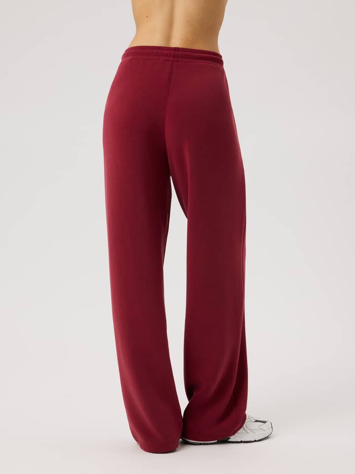 Back view of the Studio Soft Sweatpants in Cabernet (Red) featuring an elastic waistband.
