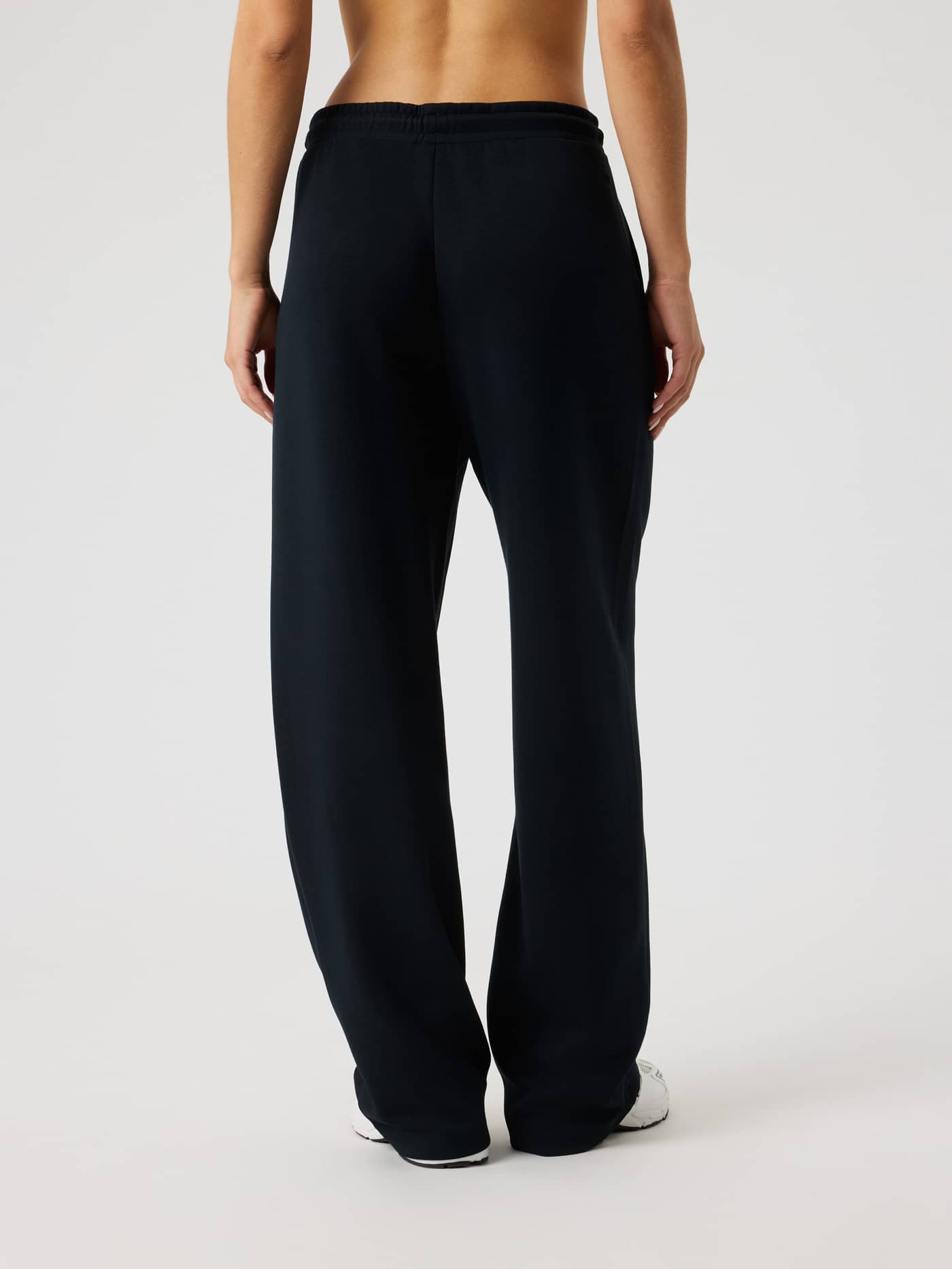 Back view of a model wearing Björn Borg Studio Soft Sweatpants in Black Beauty (Black), offering a comfortable fit. - Image 2