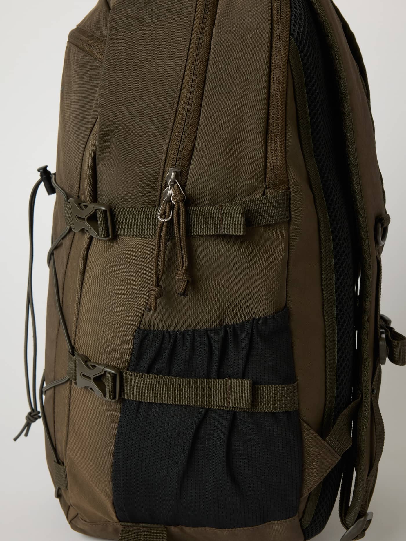 Side detail of the Borg Explorer Backpack 28L in Falcon (Brown) featuring durable polyamide and buckles for training. - Image 4