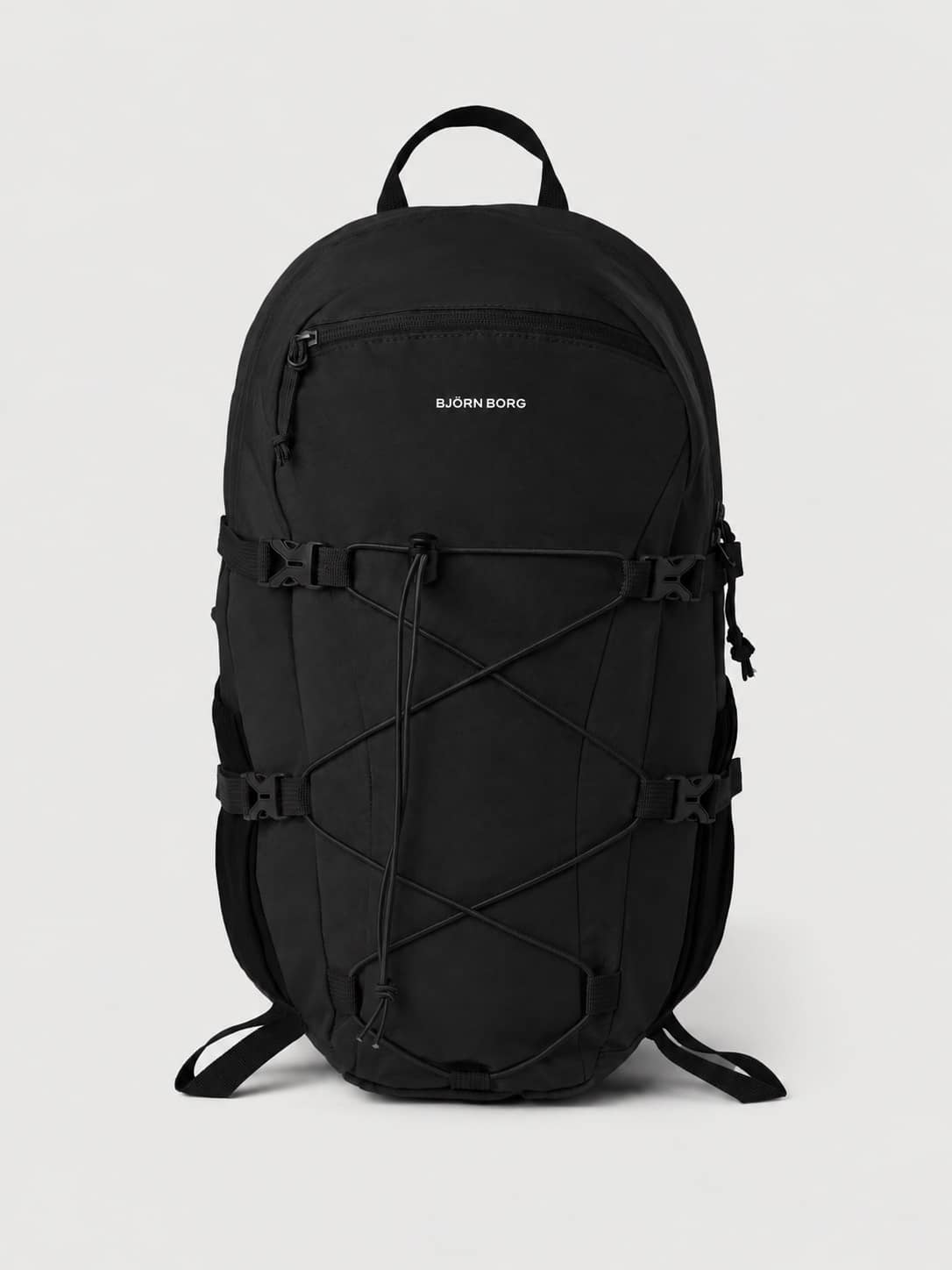Front view of the Borg Explorer Backpack 28L in Black Beauty (Black) featuring a white logo and front zipper pocket. - Image 1