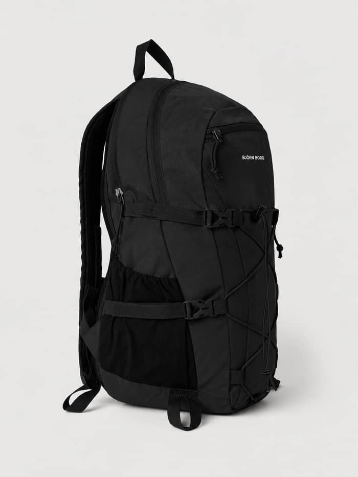 Side view of the Borg Explorer Backpack 28L in Black Beauty (Black) featuring adjustable straps and a white logo. - Image 3