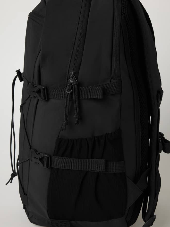 Close-up of the Borg Explorer Backpack 28L in Black Beauty (Black) highlighting the side straps and pockets. - Image 5