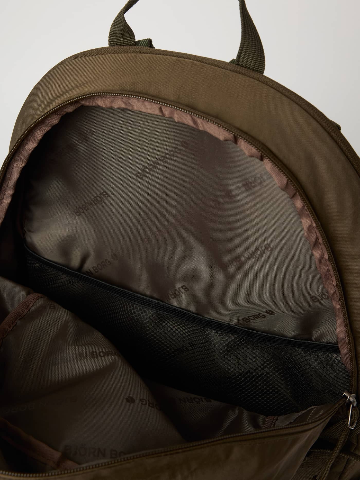 Interior view of the Falcon (Brown) Borg Explorer Backpack 28L featuring a digital sleeve for training gear. - Image 7
