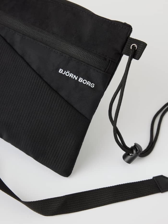 Detailed close-up of the Borg Explorer Crossover Bag in Black Beauty (Black) for training, featuring mesh and a white logo. - Image 2
