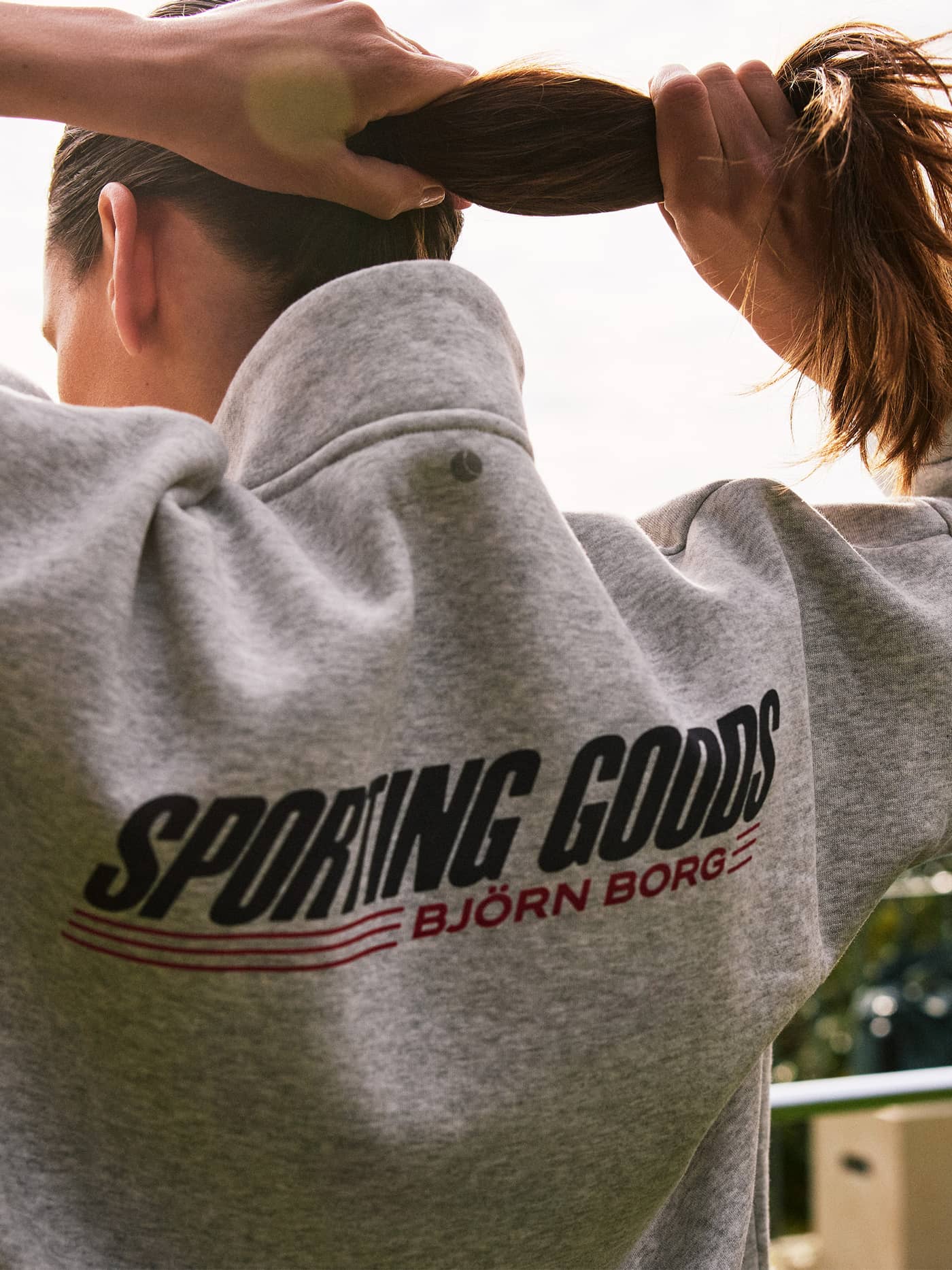 Back view of the Borg Halfzip Sweatshirt in Ultra Light Grey Melange (Grey) with a stylish graphic logo. - Image 1