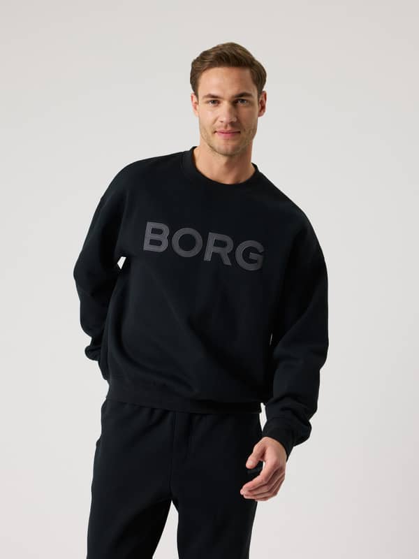 Vue de face du Borg Oversized Logo Sweatshirt en Black Beauty (Noir) avec logo noir, idéal pour le tennis et l'entraînement.