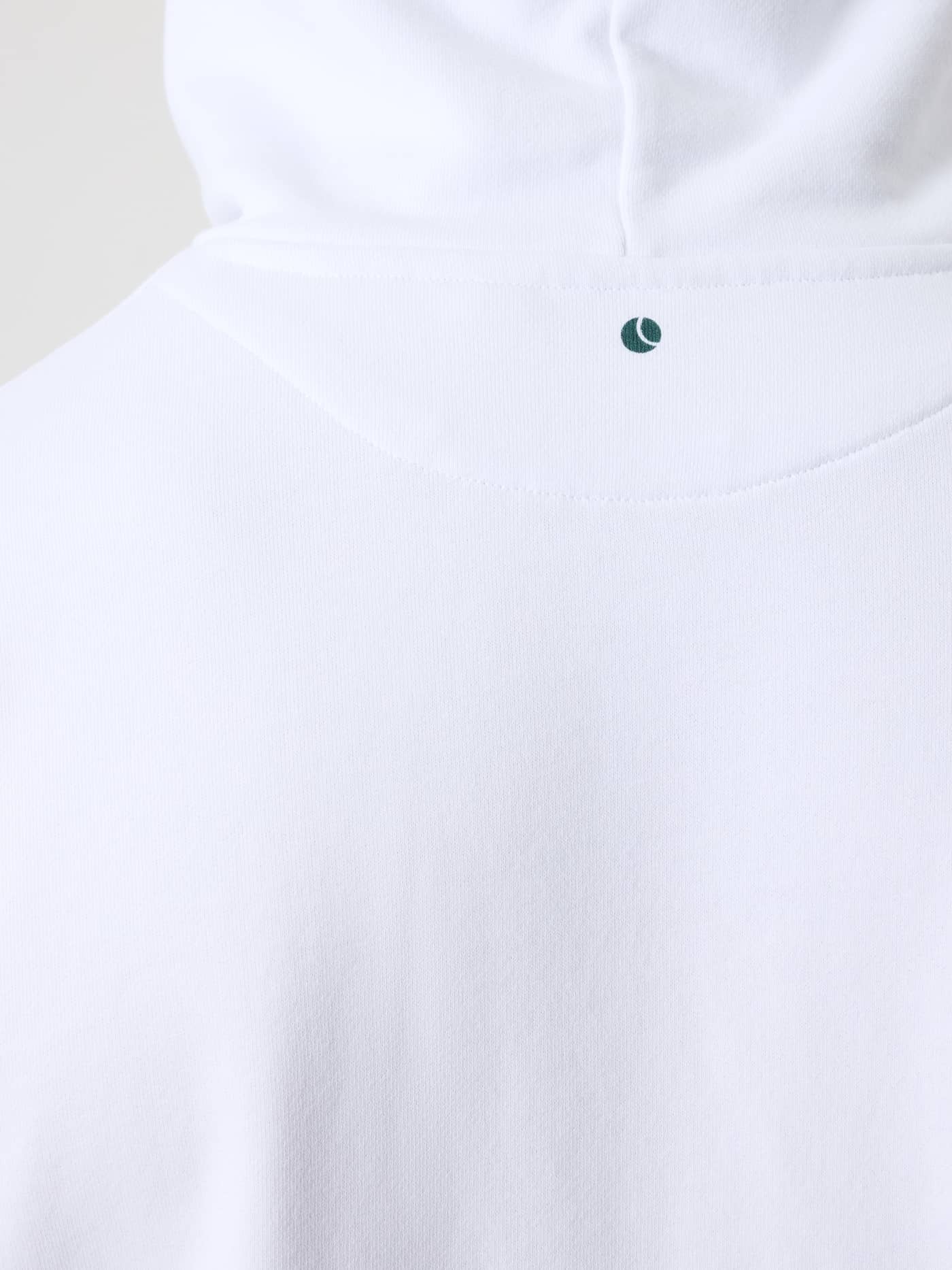 Detailed close-up of the tennis ball print on the men's Borg Classic Print Hoodie in Brilliant White (White). - Image 7